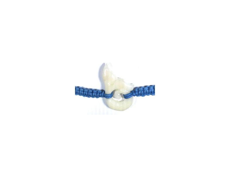All natural Hand carved Celtic Whale Tail Tagua charm on a hand woven cotton bracelet by Tu y Yo