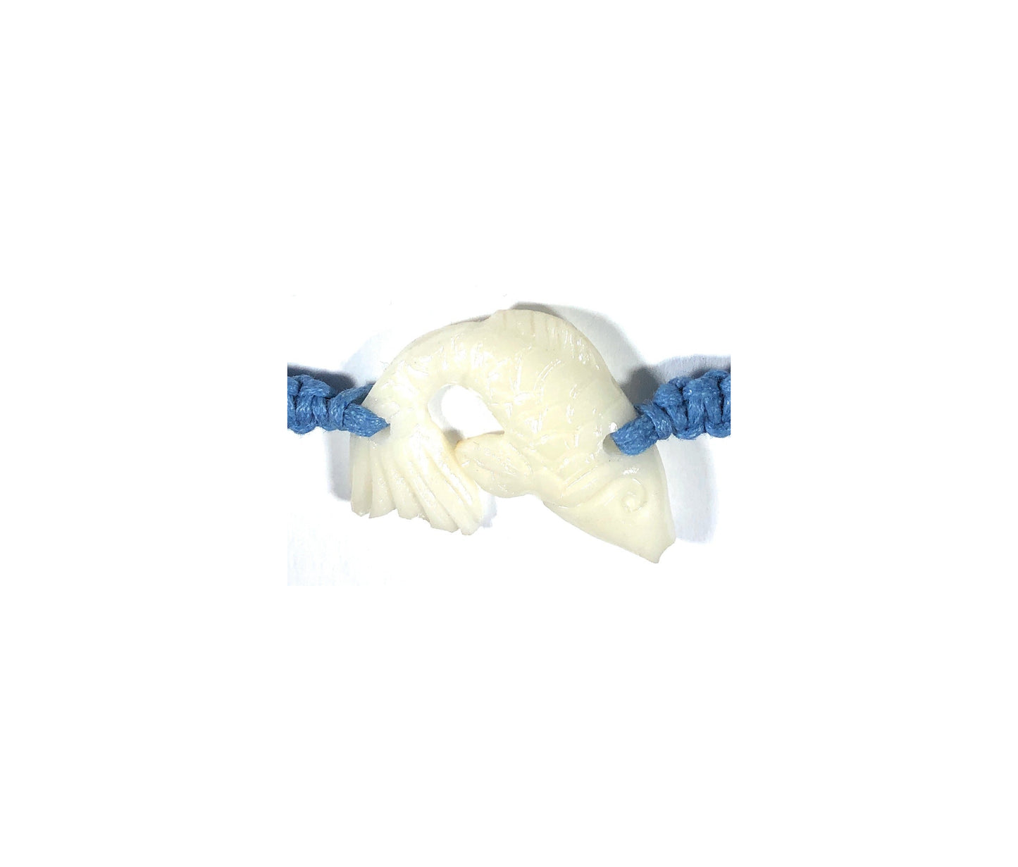 All natural Hand carved Fish Tagua charm on a hand woven cotton bracelet by Tu y Yo