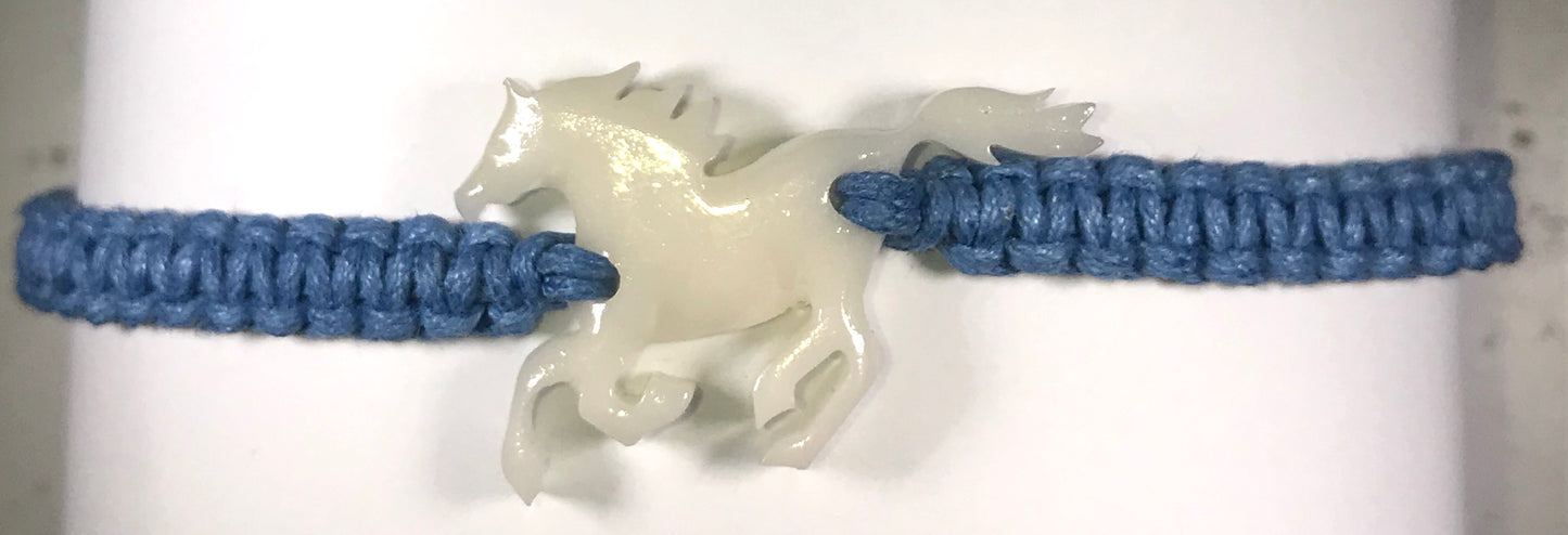 All natural Hand carved Horse Tagua charm on a hand woven cotton bracelet by Tu y Yo