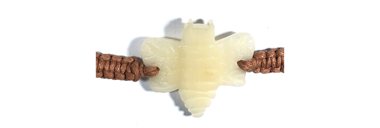 All natural Hand carved Bee Tagua charm on a hand woven cotton bracelet by Tu y Yo