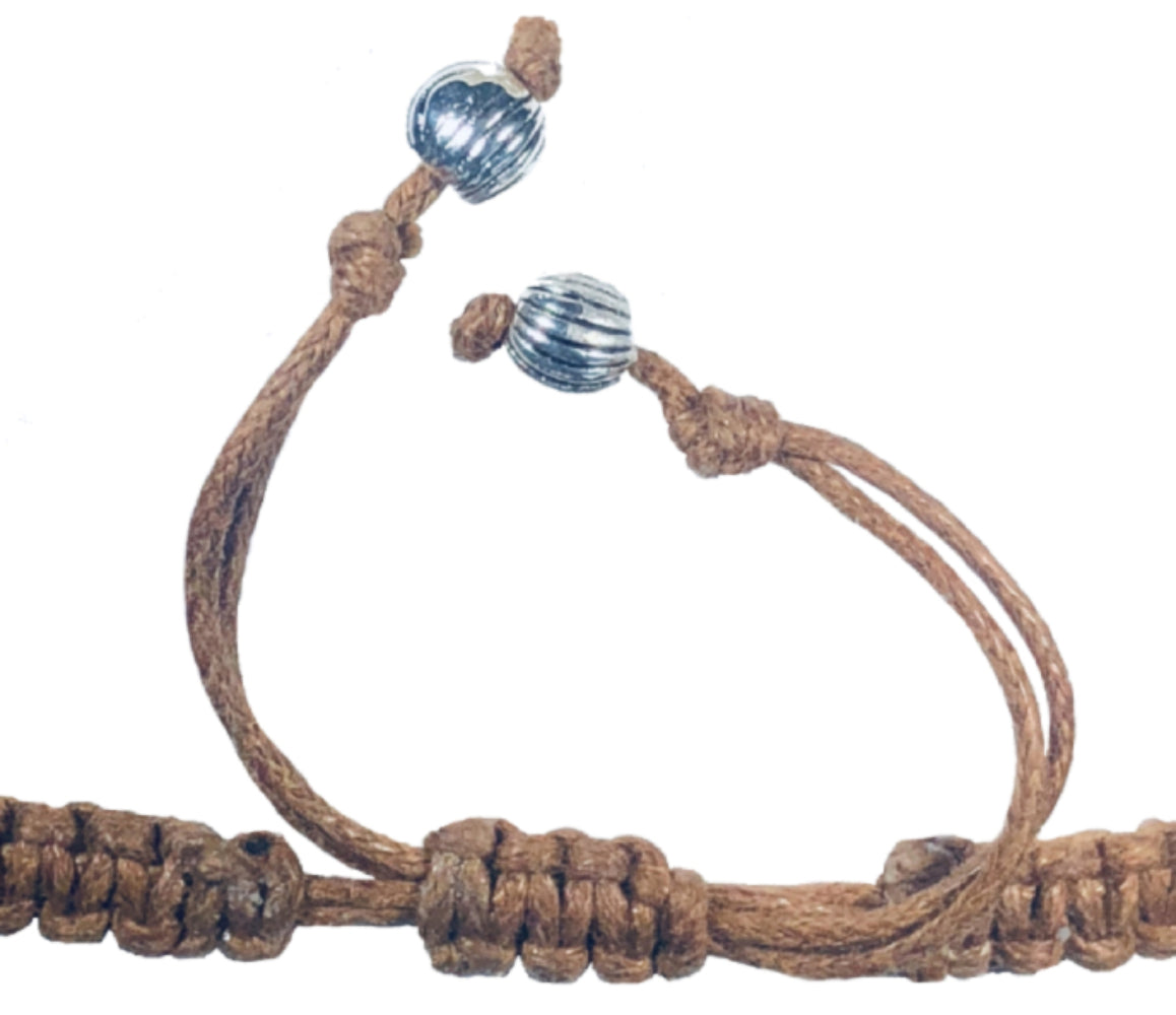 All natural Hand carved Owl Tagua charm on a hand woven cotton bracelet by Tu y Yo (red)