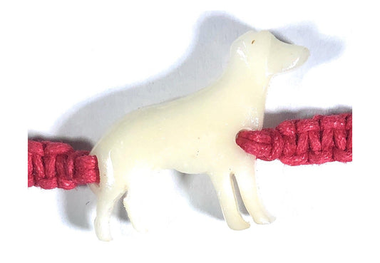 All natural Hand carved Dog Tagua charm on a hand woven cotton bracelet by Tu y Yo