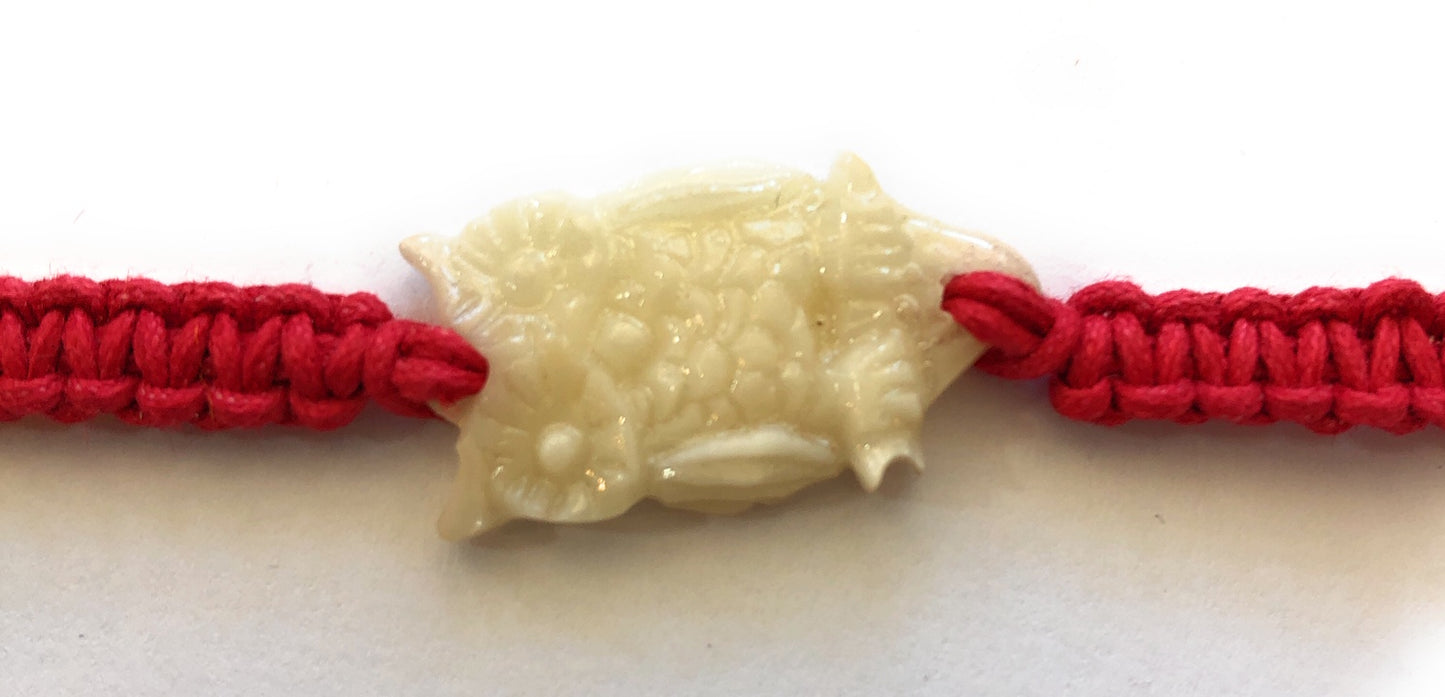 All natural Hand carved Owl Tagua charm on a hand woven cotton bracelet by Tu y Yo (red)